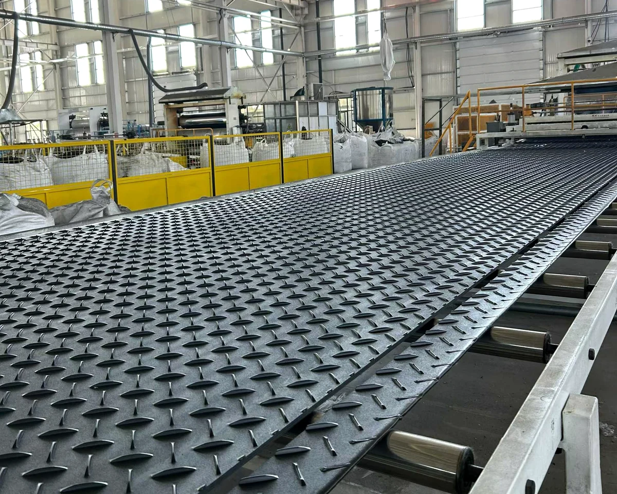 Production workshop with processing equipment and textured panels