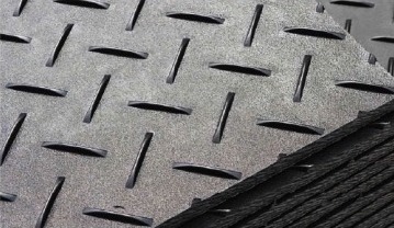 Close-up of raised tread on black ground protection mats